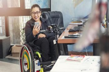 Picture Of A Disabled Person Using A Smartphone